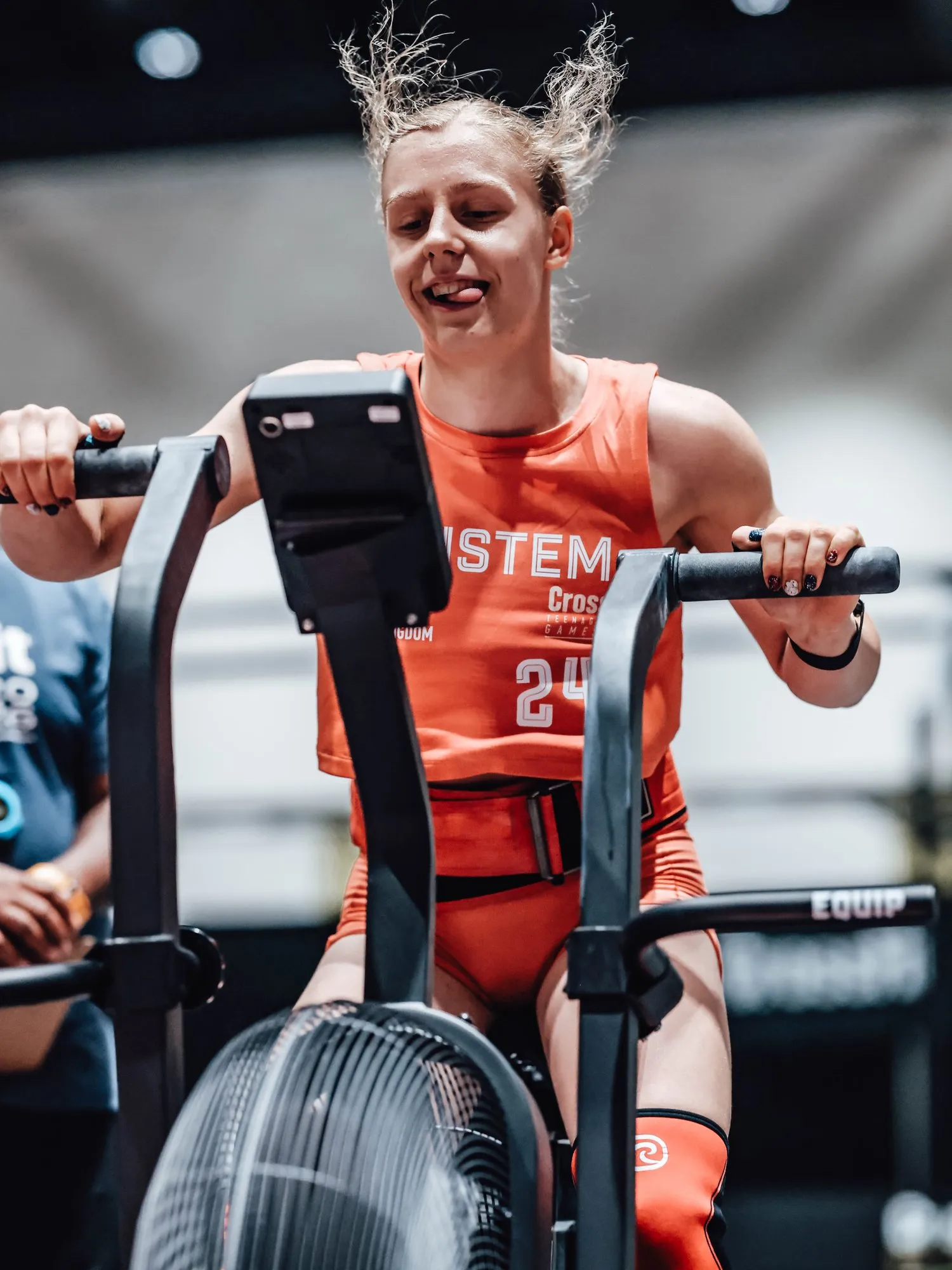 Lucy head-down on the Echo Bike during Shark Tank, Teen Games 2026