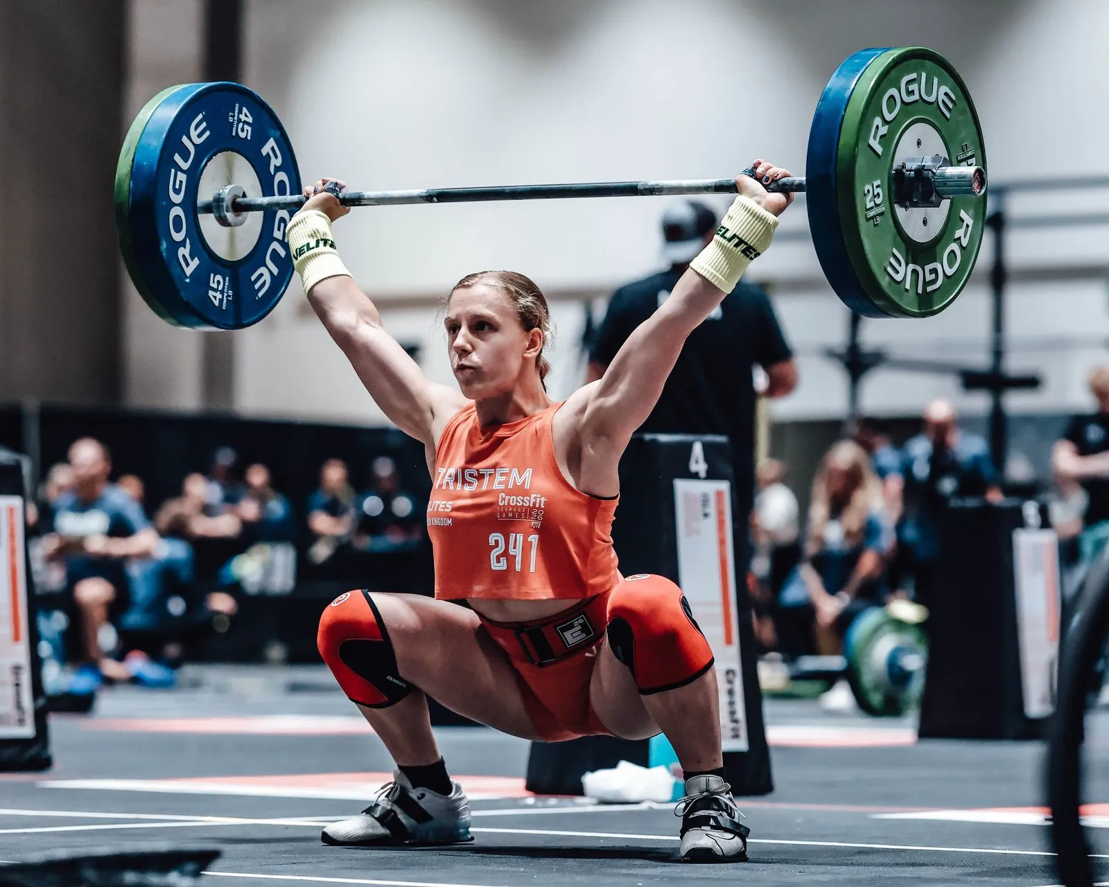 Lucy receiving a 165 lb snatch overhead during Upload, Teen Games 2026